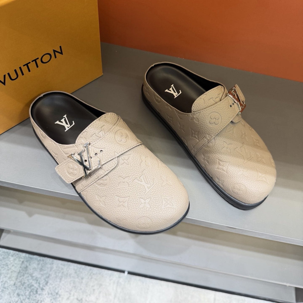 Louis Vuitton Embossed Buckle Slide Sandals — front