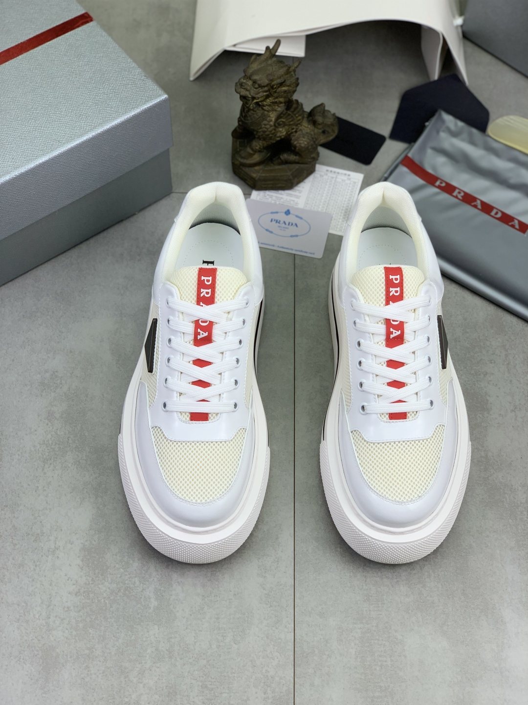 Prada Triangle Patch Low-Top Sneakers — front