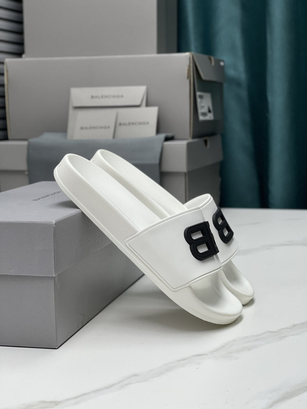 Balenciaga Raised Motif Slide Sandals — side